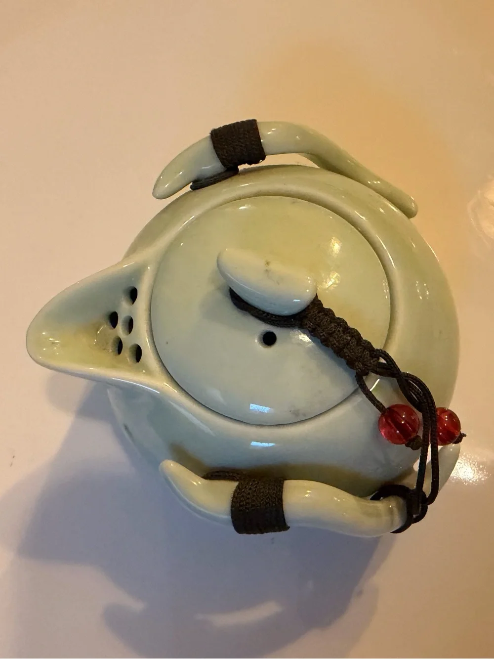 Ceramic Pale Green Mini Teapot with Integrates Strainer,Brown Cord and Red Beads